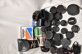 A box of approx twenty various tele-converters and extension tubes as well as several lens hoods