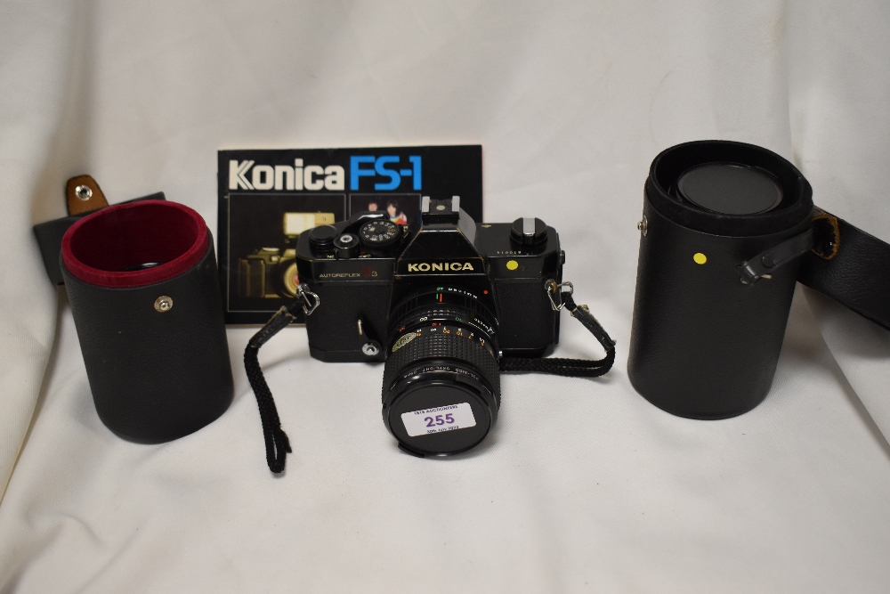 A Konica T3 camera No870614 with Hexanon AR 1:3,5-4,5 35-70mm lens, a Hexanon AR 1:3,2 135mm lens