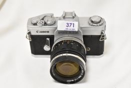 A Canon Pellix camera No139824 with Canon FL 1:1,2 58mm lens