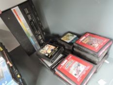A Atari 2600 Games Console with 17 Game Cartridges including Double Dunk, Pole Position,