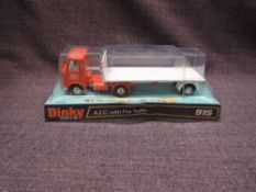 A Dinky diecast, 915 A.E.C with Flat Trailer, orange cab with white trailer and decals, on
