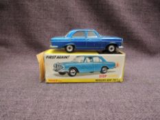 A Dinky diecast, 160 Mercedes-Benz 250 SE in metallic blue with white interior, on original card