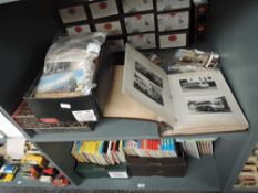 A shelf of Railway and Bus related Photographs and Postcards includes early black & white and modern