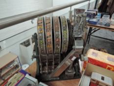 A vintage slot machine Mechanism by Aristocrat, Lucky Seven and Playing Cards seen