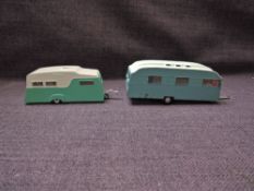 A Spot-On diecast, 264 Tourist 18ft Caravan in light blue with white roof and red blinds along