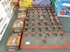 A Trooping the Colour Marching Band figure set fixed to wooden board along with seven Heritage Metal