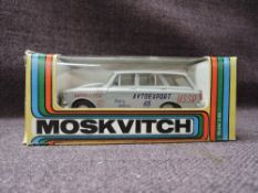 A Moskvitch 1:43 scale diecast, Rally Saloon Car in grey with white interior and USSR livery, in
