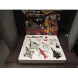 A 1985 Hasbro Takara Transformers Aerialbot Air Warrior Superion Set, comprising five smaller
