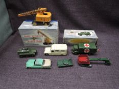 Four Dinky diecasts, 971 Coles Mobile Crane in original blue and white striped box, 626 Military