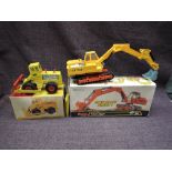 Two Dinky diecasts, 984 Atlas Digger AB1702, in yellow with chrome shovel, orange chassis and