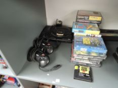 A Sega Mega Drive 16-Bit Console with 19 Game Cartridges in original plastic boxes with