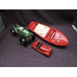 A Schuco Examico 4001 clockwork and tin plate car with key, Triang plastic model Cruiser Boat and