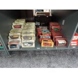 A shelf of Matchbox Models of Yesteryear diecasts, in straw, red and mixed colour display boxes,