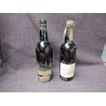 A bottle of Taylor's Quinta De Vargella's 1974 Vintage Port, bottled in Oporto 1976 by Taylor,