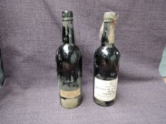 A bottle of Taylor's Quinta De Vargella's 1974 Vintage Port, bottled in Oporto 1976 by Taylor,