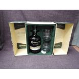 A bottle of Connemara Peated Single Malt Irish Whiskey, 70cl, 40% vol with two glasses in card