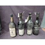 Four bottles of Vintage Port, Croft 1963, Taylor's 1963,seapage seen, Cockburn's 1970 and Warre's