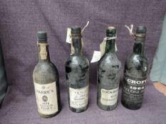 Four bottles of Vintage Port, Croft 1963, Taylor's 1963,seapage seen, Cockburn's 1970 and Warre's