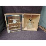 A Hennessy Cognac wooden and circular Cave a' Cigares Humidor containing empty glass bottle,