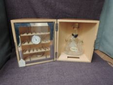 A Hennessy Cognac wooden and circular Cave a' Cigares Humidor containing empty glass bottle,