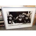 A large framed and mounted Beatles print - measuring 86cm x 65cm ' A Hard Day's Night '