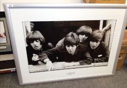 A large framed and mounted Beatles print - measuring 86cm x 65cm ' A Hard Day's Night '