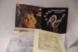 A twelve album lot with Mick Ronson , Genesis and more here