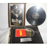 A small Beatles lot including a clock and a copy of the Black and Gold album which has been put into