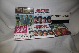 A selection of Beatles tin - six in total and seven inch single size - really nice decorative items