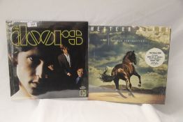 A lot of two albums by The Doors and Bruce Springsteen in EX / EX - later issues and they look