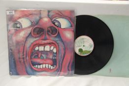 A lot of two King Crimson albums - Court is the Palm Tree gatefold and both are VG+ / VG+ - closer
