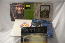 A mixed lot of albums and 12' singles with rock and indie on offer here