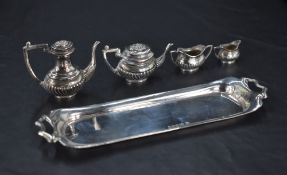 A cased Queen Elizabeth II miniature five-piece silver teaset, of half gadrooned oval baluster form,