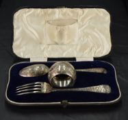 A cased Victorian silver christening set, comprising a napkin ring, fork and spoon, each with