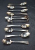 A group of nine Victorian silver teaspoons and matching sugar tongs, Old English pattern with pip