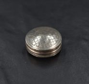 A George III silver pill box, of slightly domed circular form with pull-off cover engine-turned with