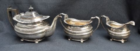 An Edwardian silver three-piece teaset, comprising teapot, sugar and cream, each of rounded