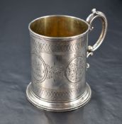 A Victorian silver christening mug, of cylindrical form with scrolled loop handle and bands of