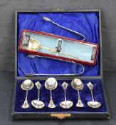 A cased set of six silver coffee spoons with oval bowls, twisted stems and scroll moulded terminals,
