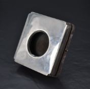 A George V silver mounted watch holder, of hinged square form with re-entrant corners, opening by