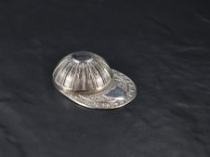 A Queen Elizabeth II silver caddy spoon, in the form of a Jockey's cap with embossed decoration