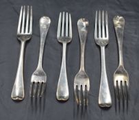 A harlequin set of six George III Hanoverian pattern forks, each engraved with dog and crown