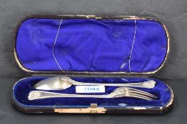 A cased Victorian silver christening set, comprising bead and shell pattern fork and spoon, marks
