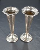 A pair of George V silver vases, of trumpet form with petal moulded rim and conforming moulding to