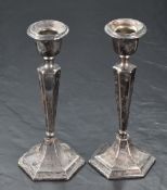 A pair of George V silver vases, of classical form with circular sconce over tapering hexagobal stem