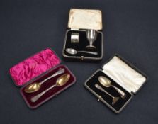 A cased George V silver christening set, comprising egg cup, napkin ring and spoon, each with