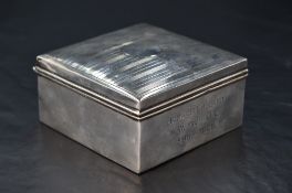 Bank of England interest* A George V silver cigarette box, of hinged square section form, the