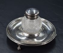 A Victorian silver and cut-glass ink stand, the thistle form cut-glass well with hinged silver cover