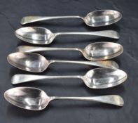 A group of six George V silver Old English pattern dessert spoons, with pip reverse and engraved
