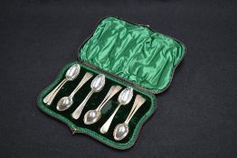A matched set of twelve late Victorian/Edwardian silver teaspoons, Old English pattern with engraved